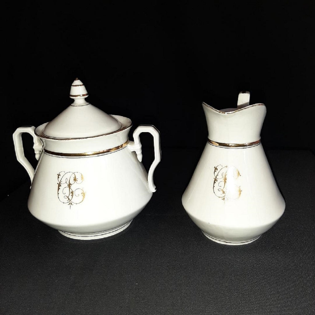 Porcelain sweetener and milk jug with cipher