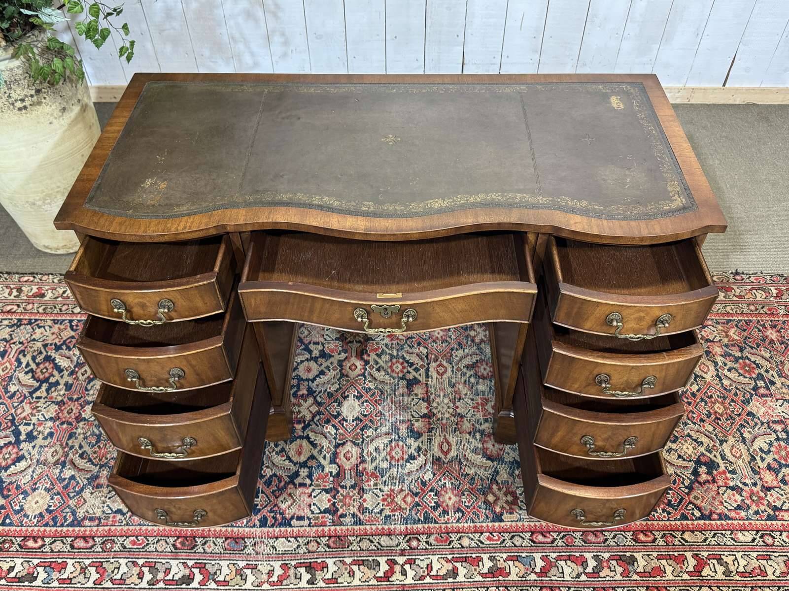 English desk from the 1950s in mahogany with a leather top.