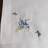 Square of hand-embroidered fabric forget-me-not
