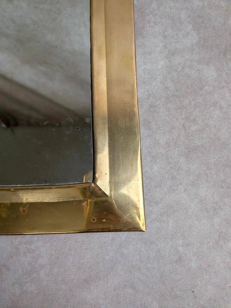 Vintage Moroccan wall mirror in brass, arch shape.
