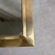 Vintage Moroccan wall mirror in brass, arch shape.