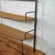 low metal and rattan shelf from the 50s