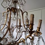 Lustre ancien à 8 bras de lumière à pampilles en bronze et cristal