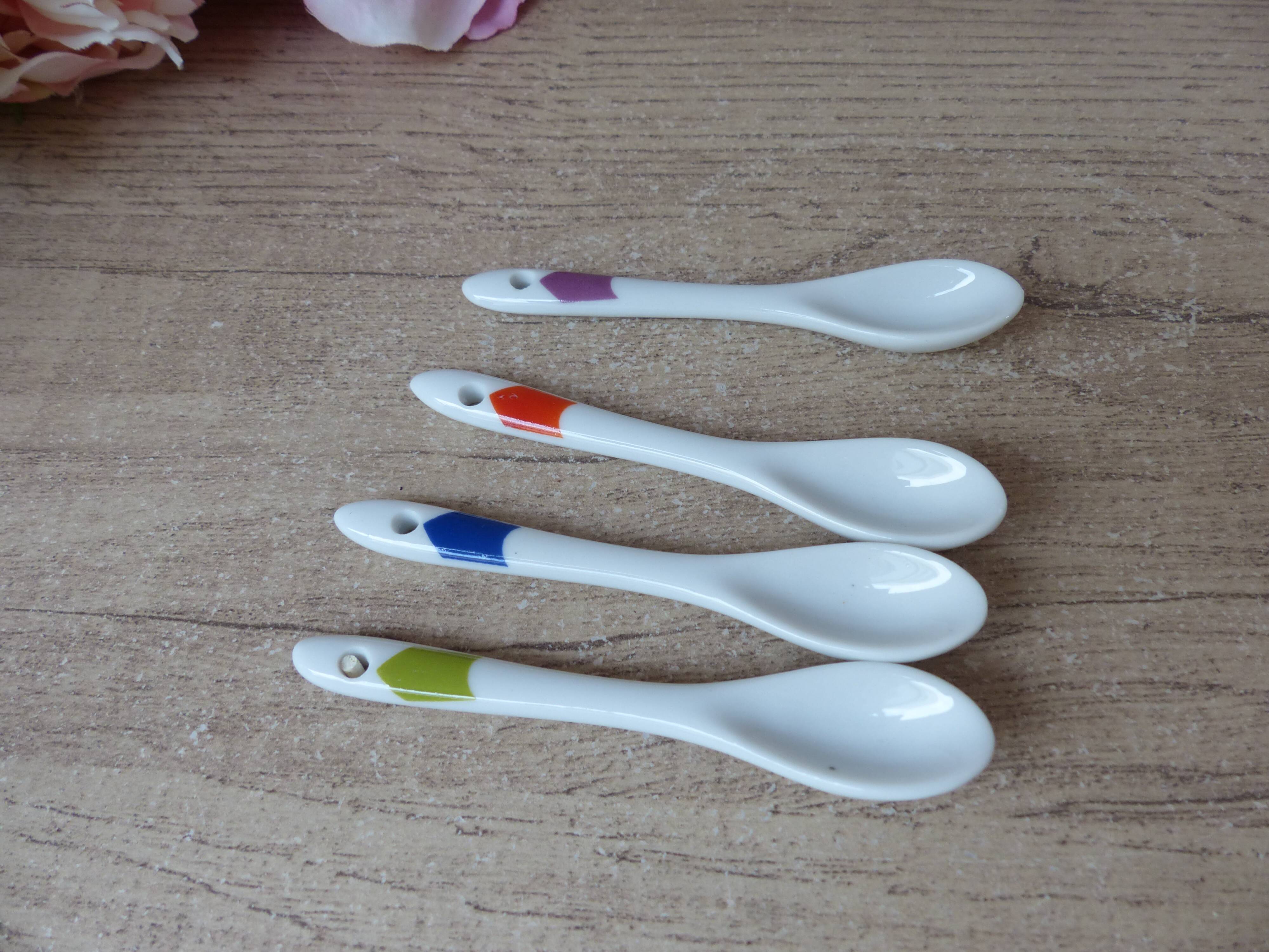 Set of 4 egg cups with spoons, colourful vintage salt and pepper shakers.