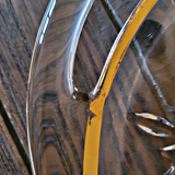 Vintage glass moulded aperitif server with handles and gilding.