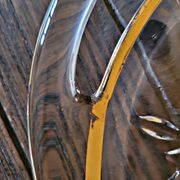 Vintage glass moulded aperitif server with handles and gilding.