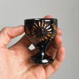3 black ceramic egg cups with floral patterns