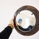 Decorative mirror in wood and gold metal