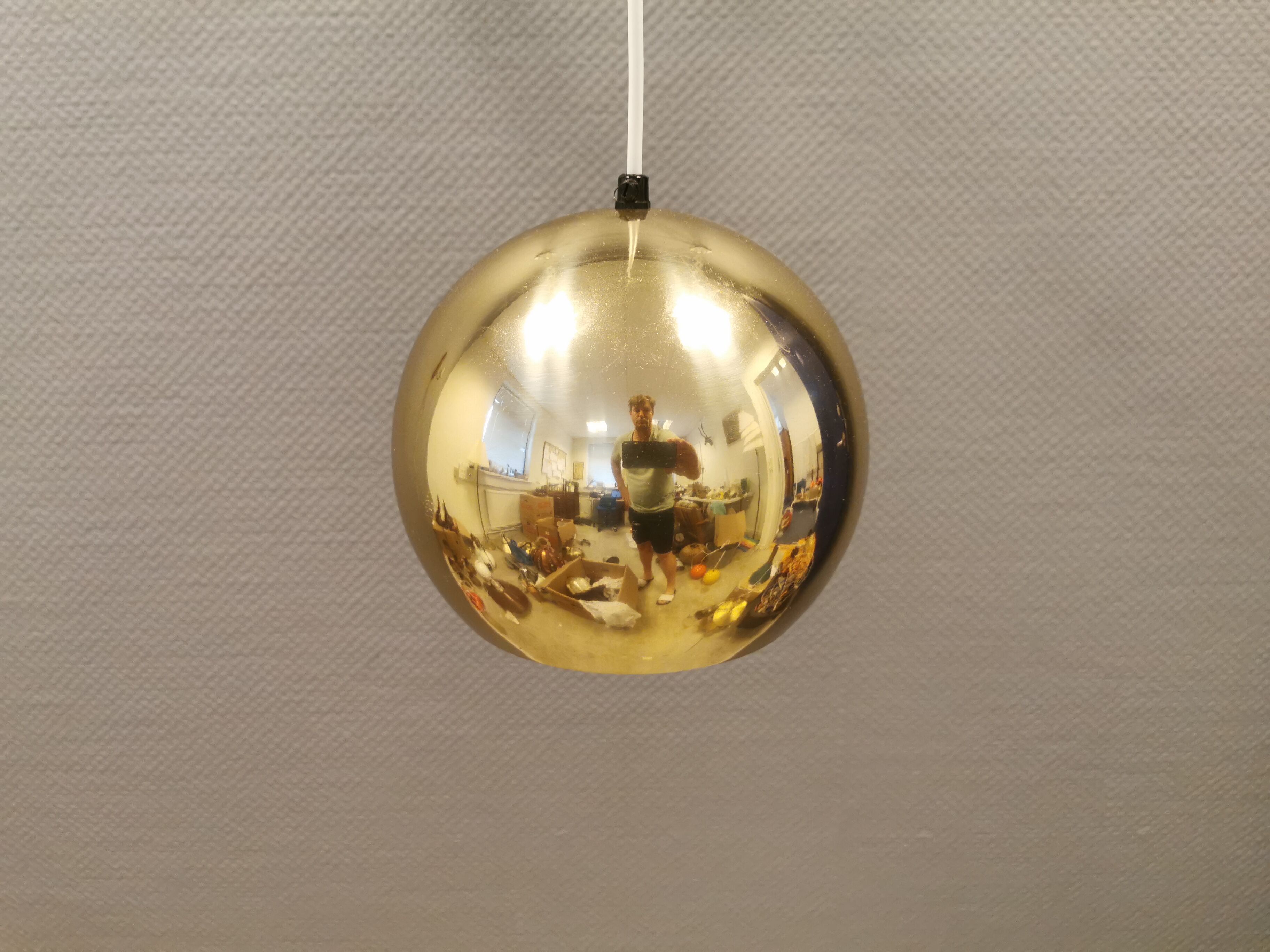 Danish ball lamp from the 80s, in gold colored lacquer.