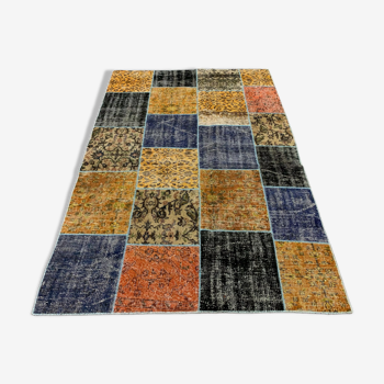 Distressed vintage turkish patchwork rug 218x150 cm wool medium