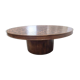 Vintage round wooden coffee table with a copper top.