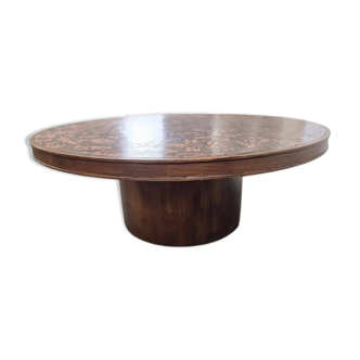 Vintage round wooden coffee table with a copper top.