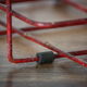 Red metal bottle holder