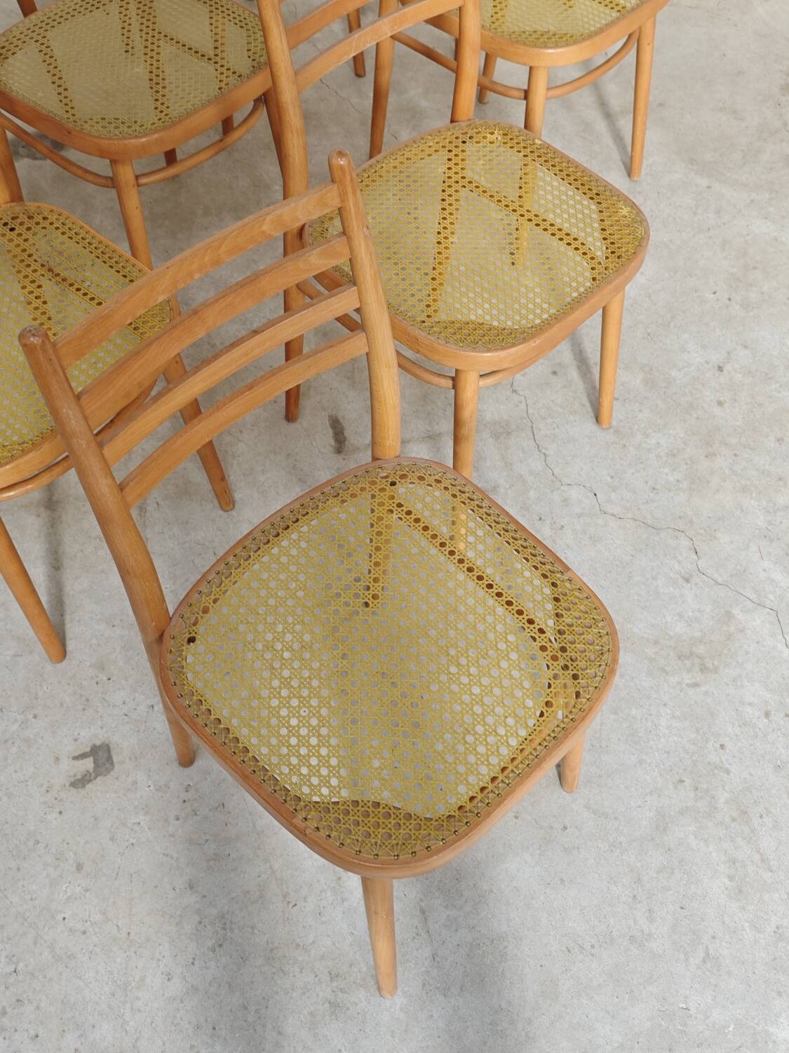 Set of 10 Bystrice tone wooden and caned chairs from the 1960s.