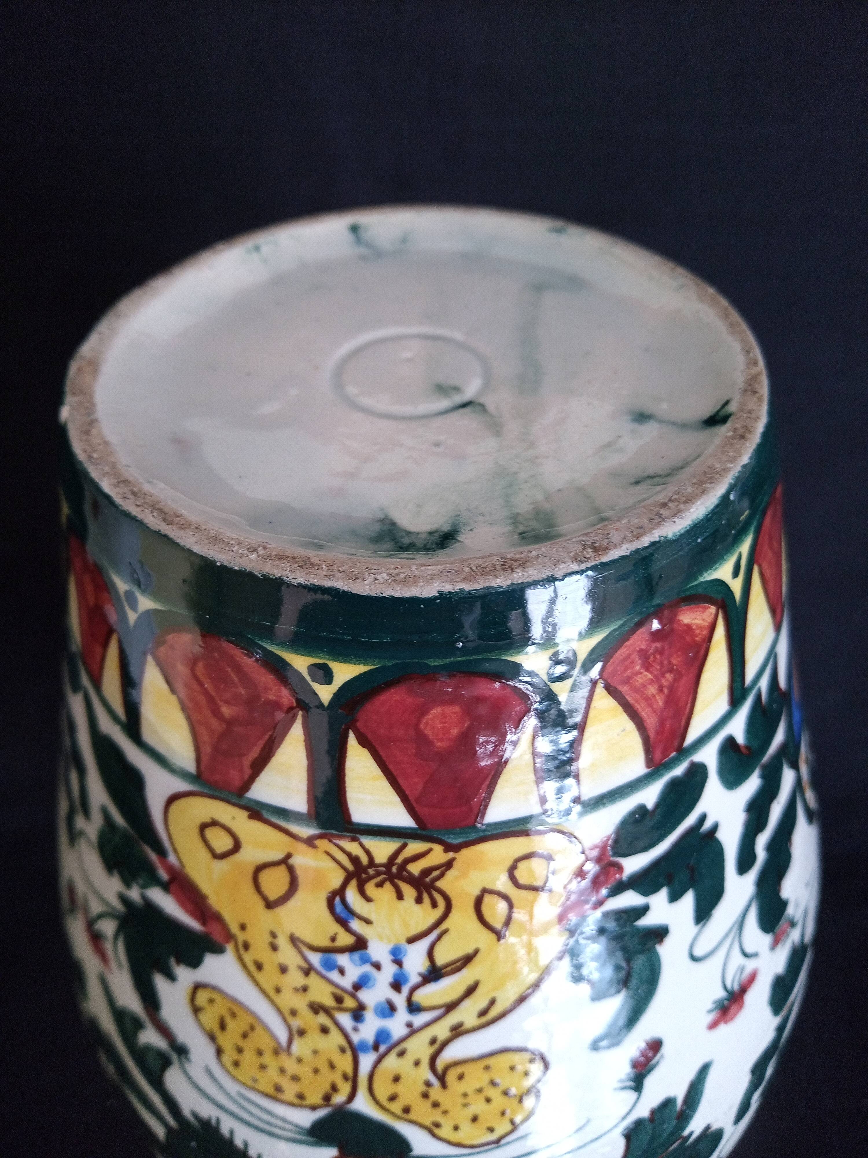 Art Deco ceramic vase with brightly colored abstract patterns