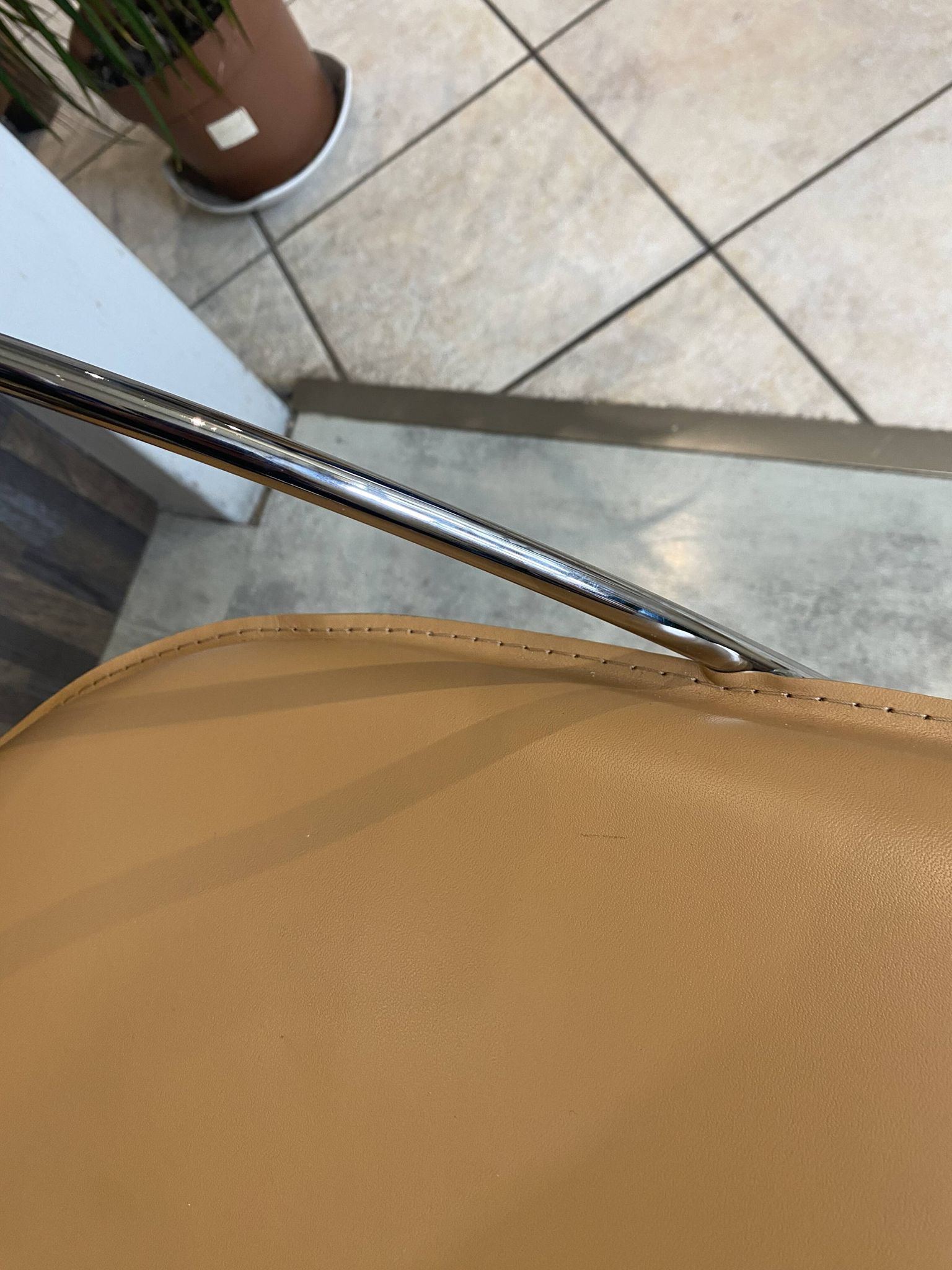 1 Linda armchair chair by Arrben in camel brown leather with a chrome steel frame.