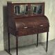 Cylinder desk in mahogany and mahogany veneer, Louis XVI style, 19th century.