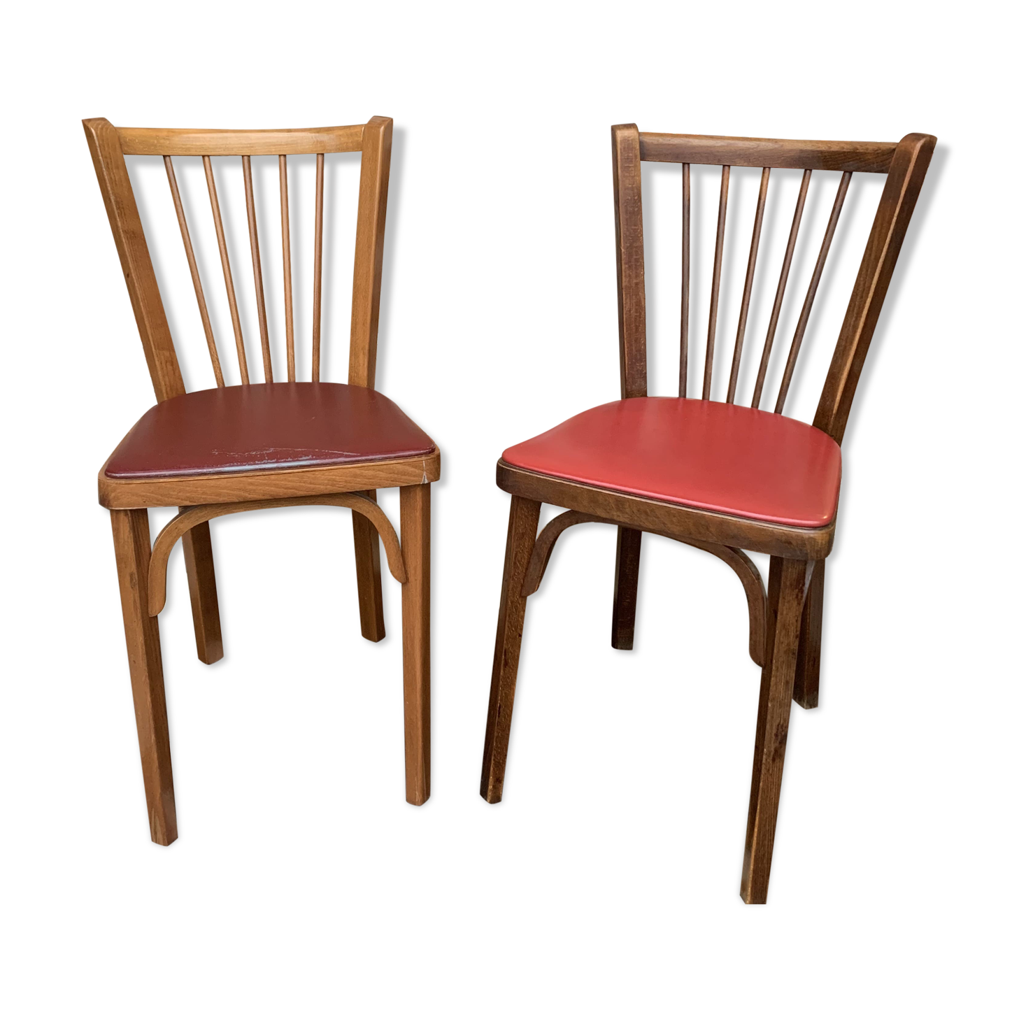 2 baumann bistro chairs sitting skai 1 red and 1 burgundy