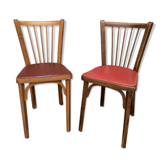 2 baumann bistro chairs sitting skai 1 red and 1 burgundy