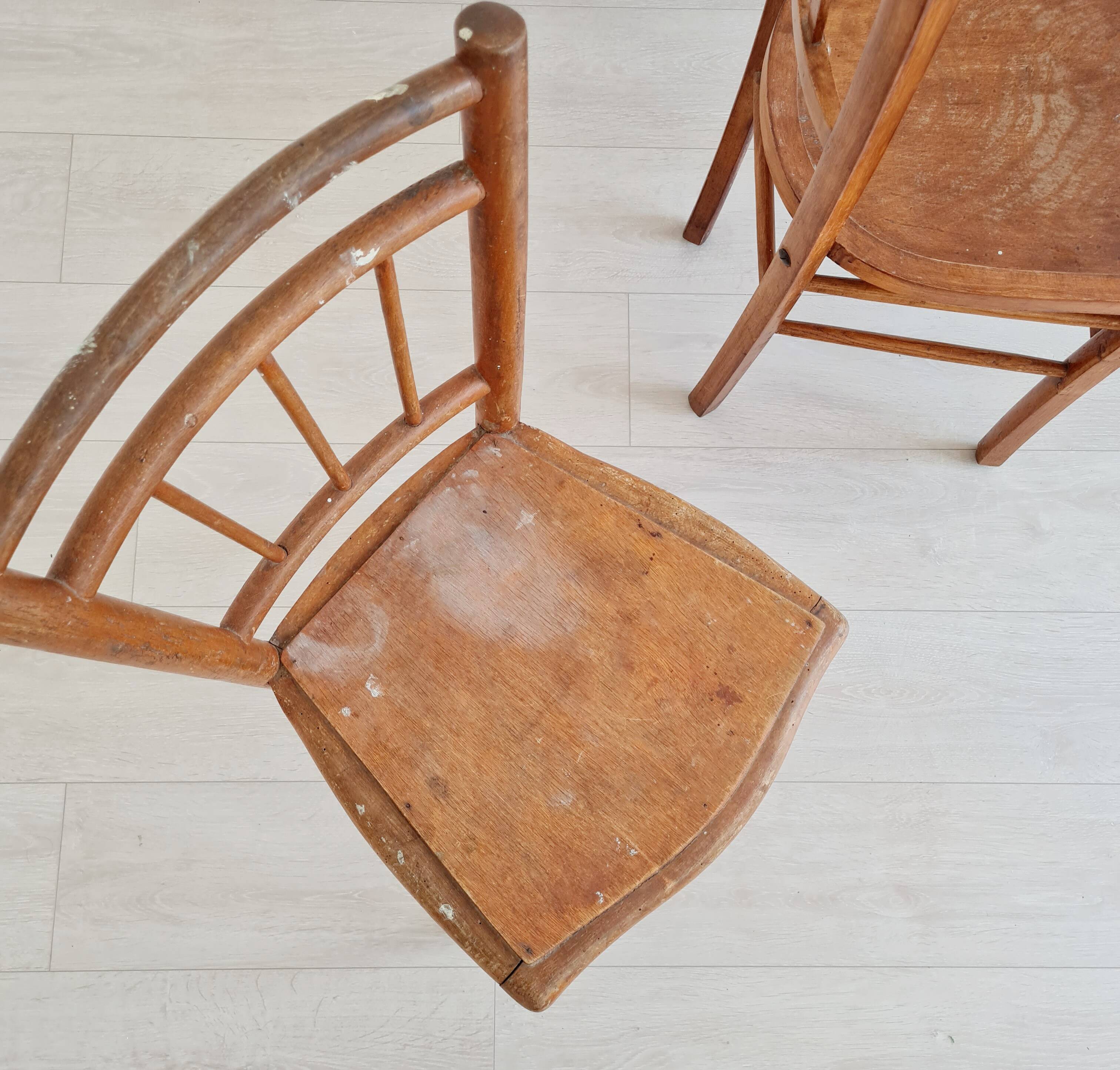 Mismatched wooden bistro chairs