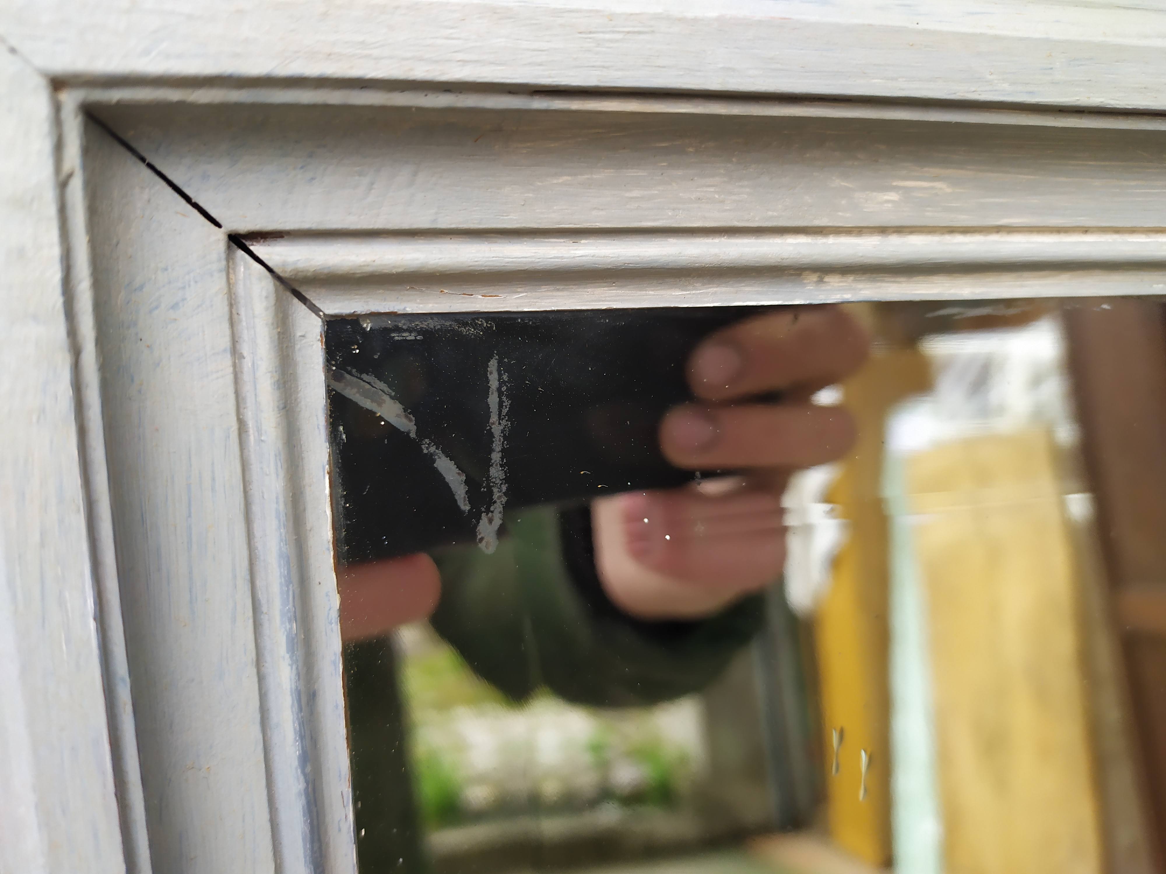 Old grey patinated mirror