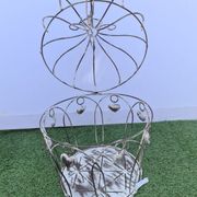 Decorative bird cage with iron hearts