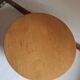 Round beech coffee table with curved legs, 1980s.