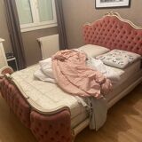 Upholstered bed in rosewood fabric