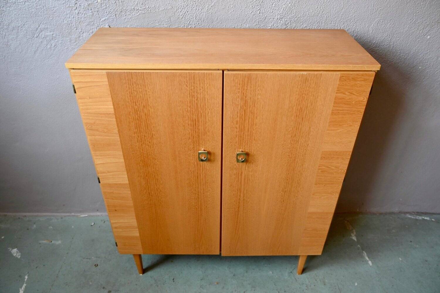 Vintage 1960s shoe cabinet in light wood and chrome metal.