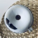 Old enamelled metal candlestick