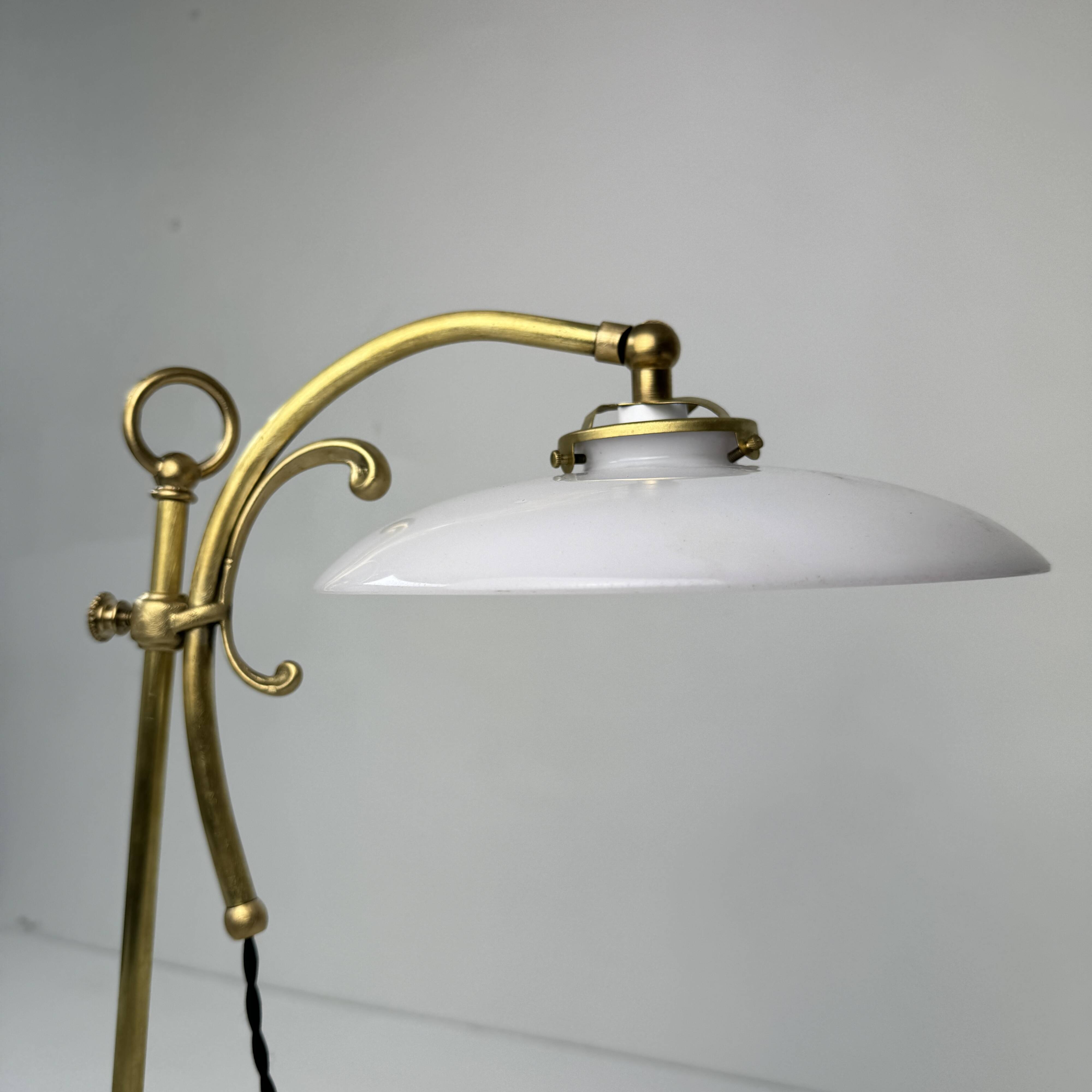 Vintage desk lamp that raises and lowers.
