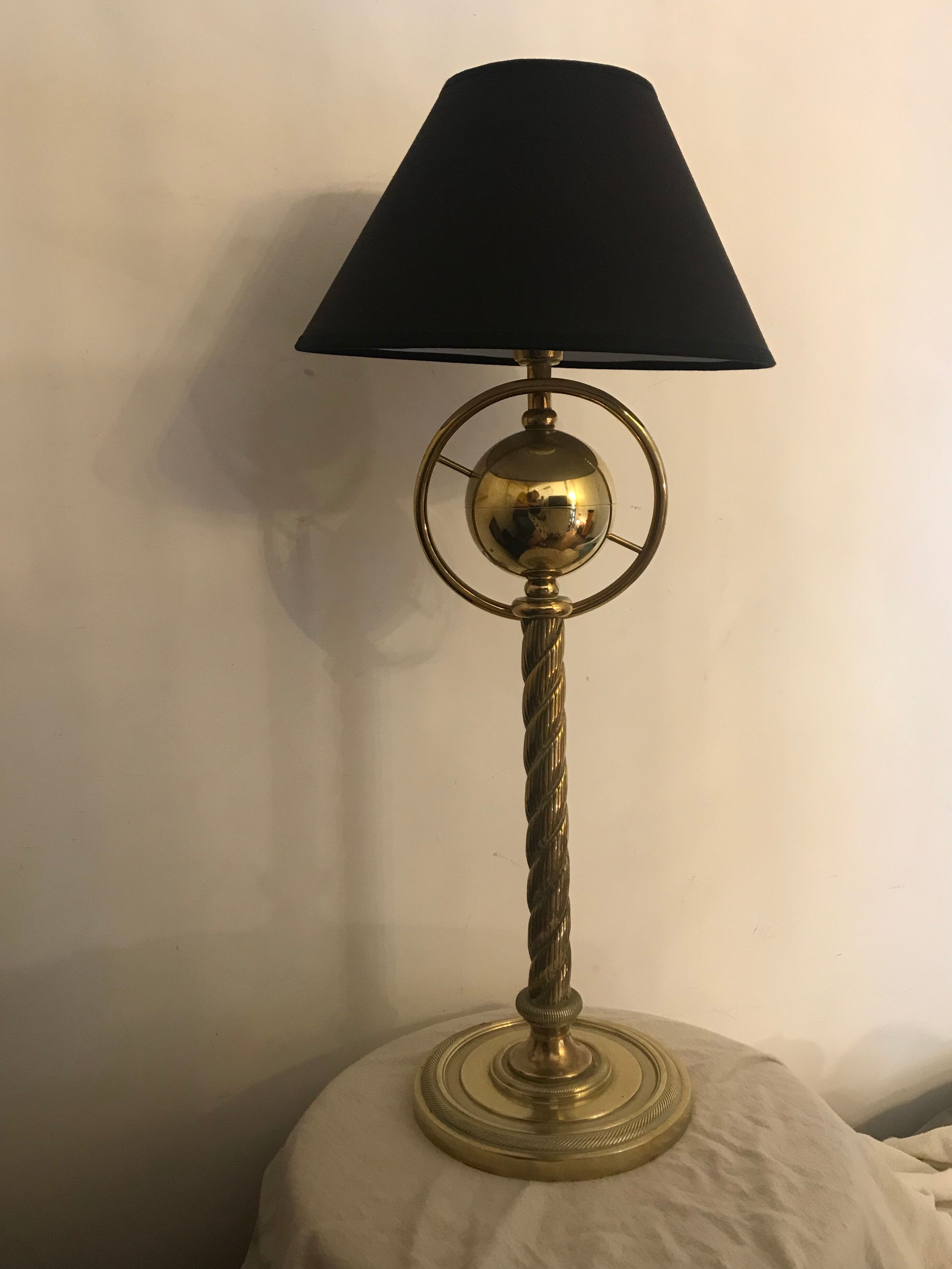 Brass lamp with removable ring around a globe