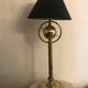 Brass lamp with removable ring around a globe
