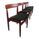 Four Danish mid-century teak armchairs.