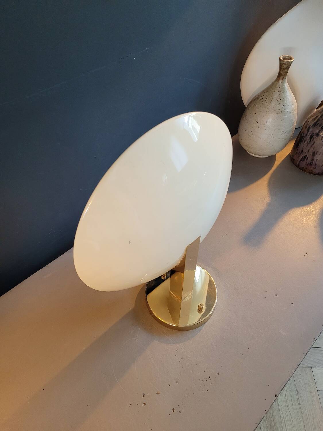 Gold and cream white saucer wall sconce