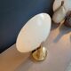 Gold and cream white saucer wall sconce