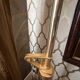 "Lounge Gun" floor lamp by FLOS by Philippe Starck – Gold