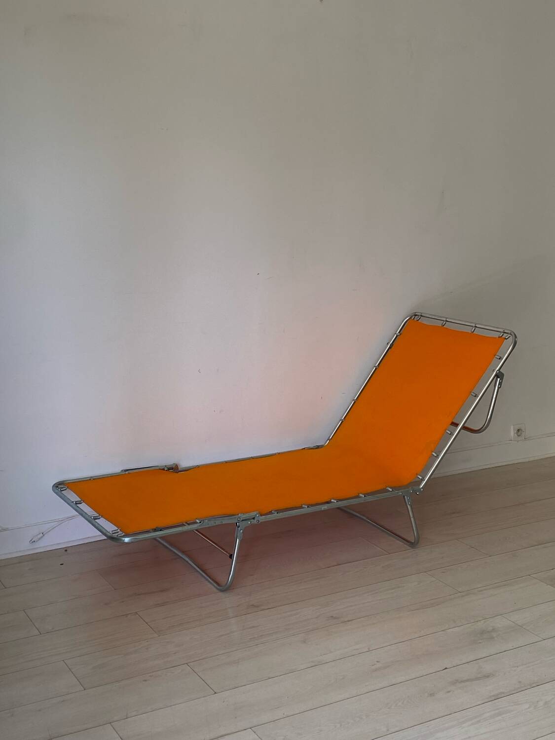 Orange and metal deckchair 1970