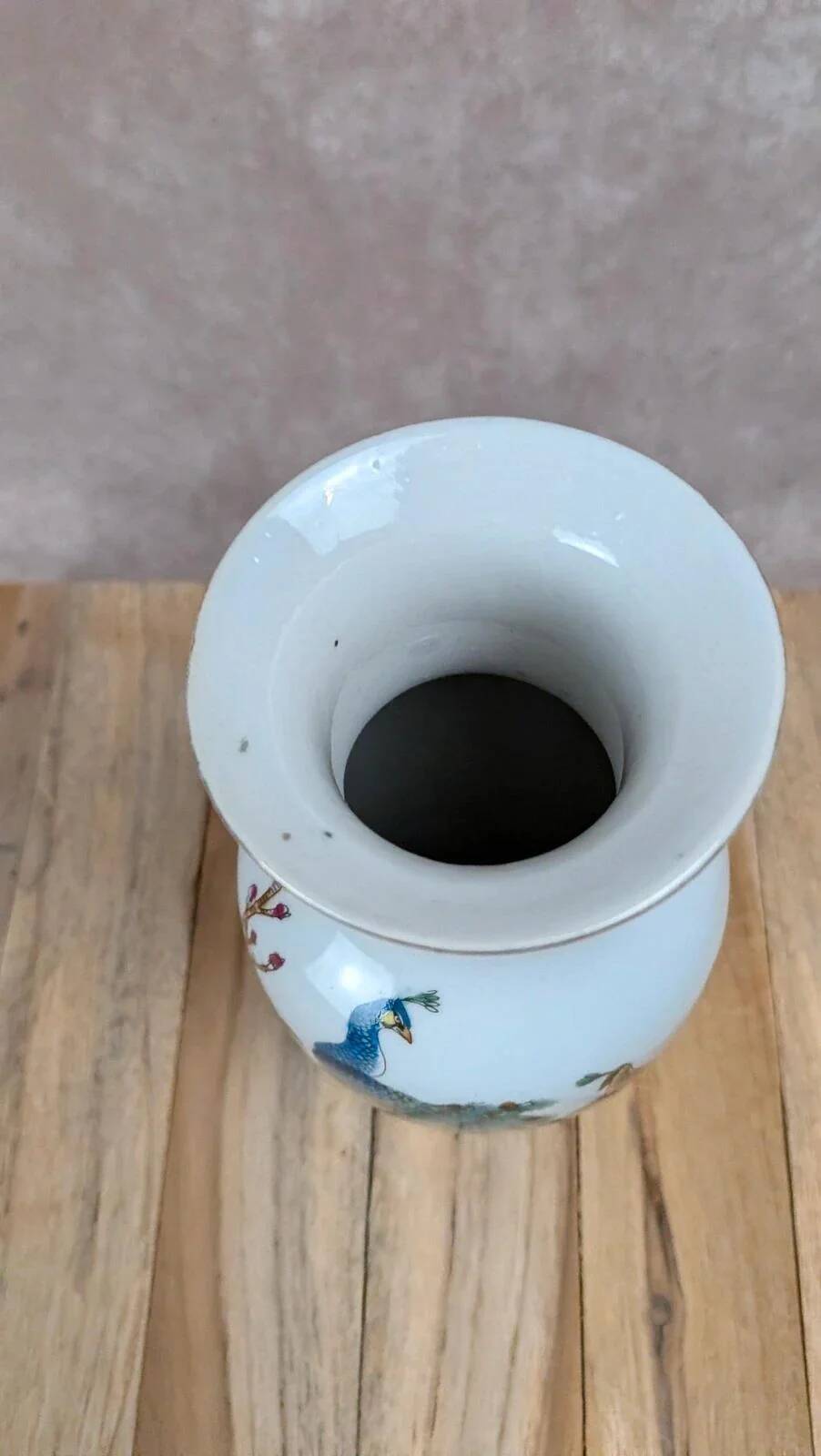 Asian vase decorated with peacock in porcelain