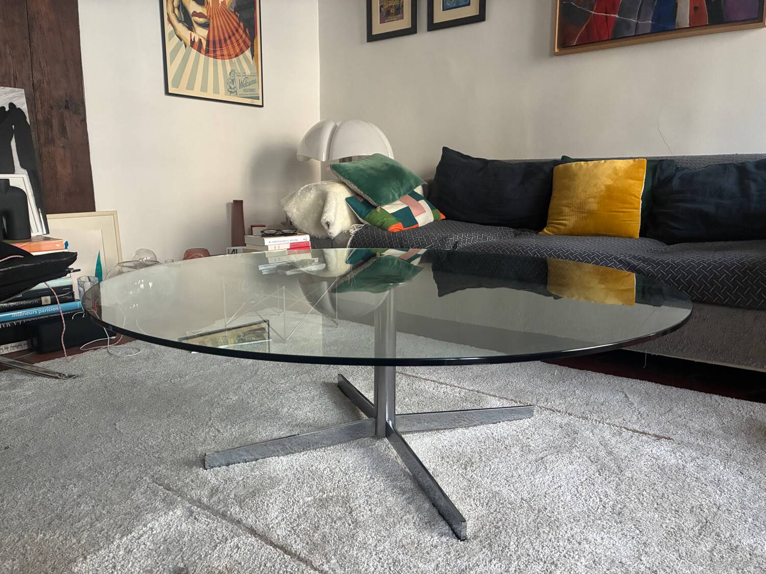 Glass coffee table with chrome base in the style of Roche Bobois