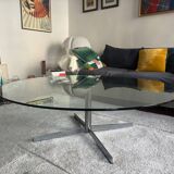 Glass coffee table with chrome base in the style of Roche Bobois