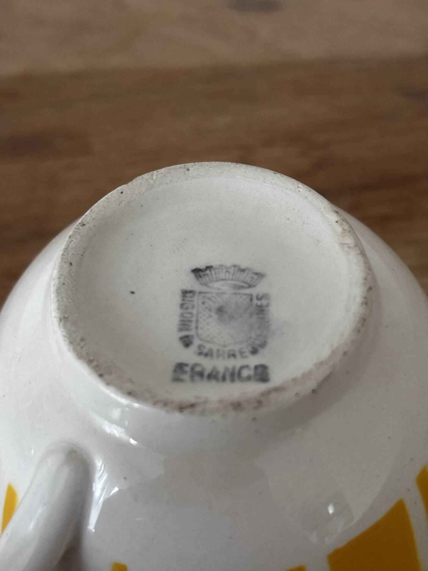 Set of two antique yellow Digoin Sarreguemines cups.