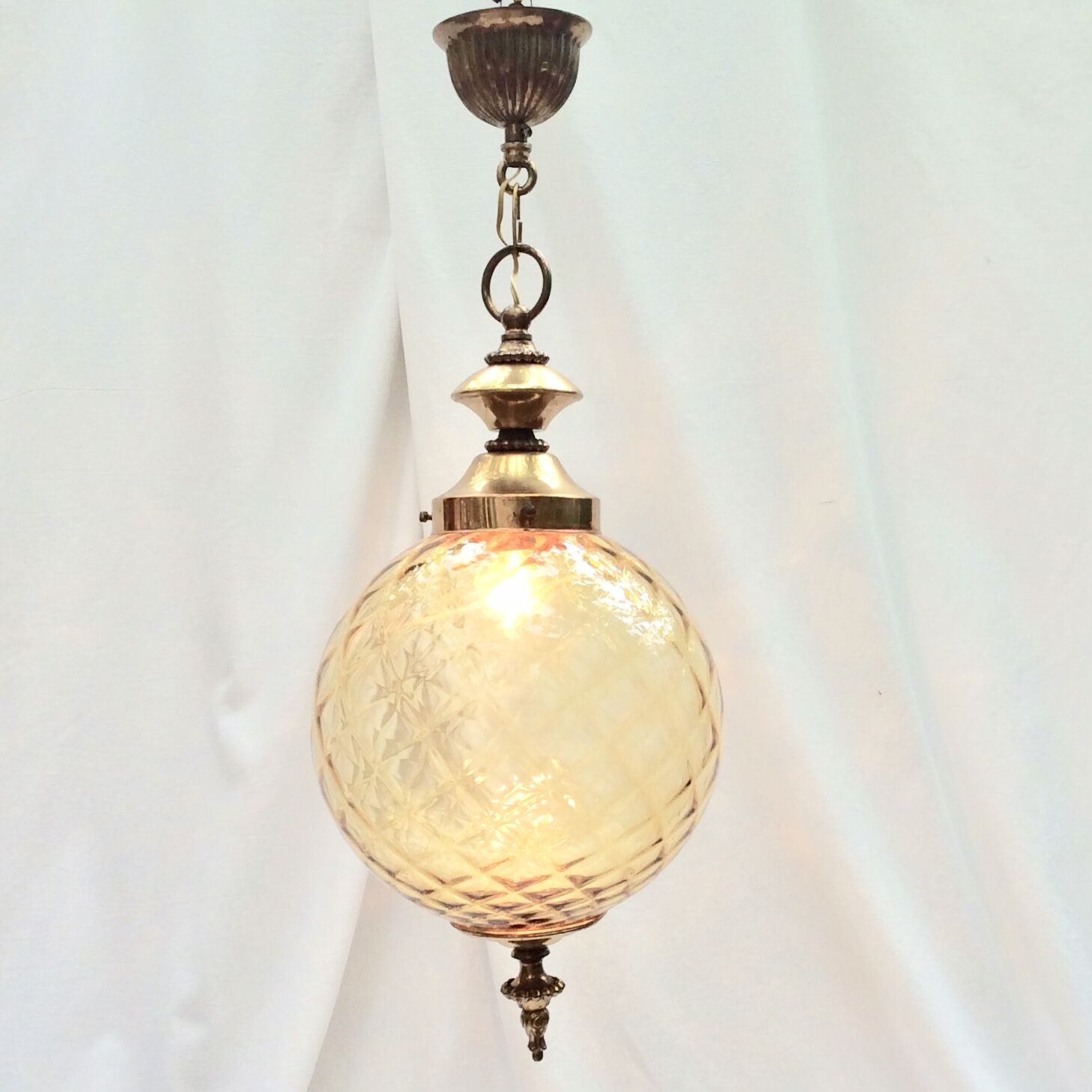 Amber glass suspension with brass
