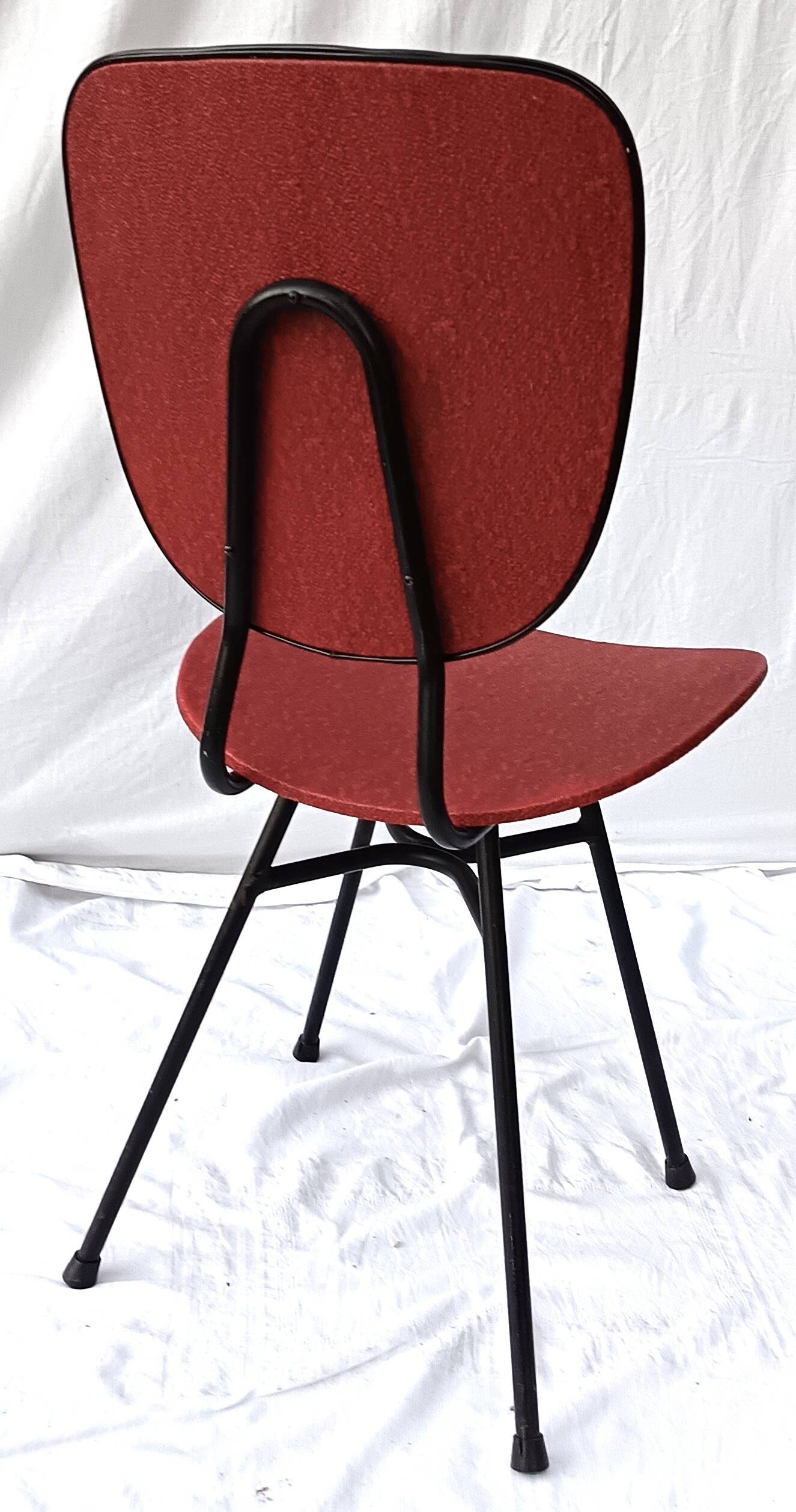 sixties chair with steel tube legs and a skaï seat