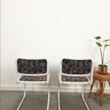 Pair of vintage tubular frame dining chairs