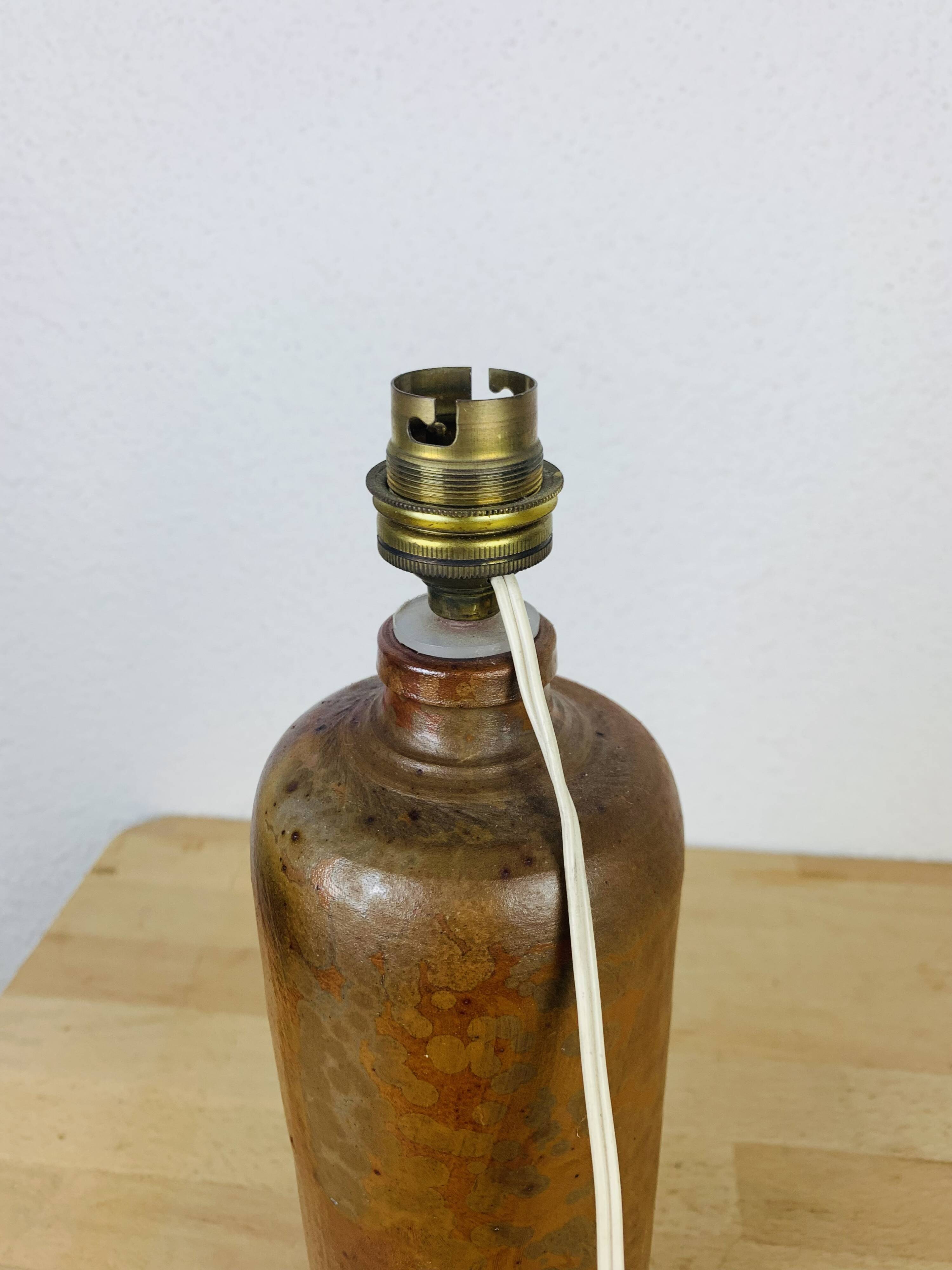 Stoneware bottle lamp and vintage wool lampshade