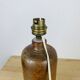 Stoneware bottle lamp and vintage wool lampshade