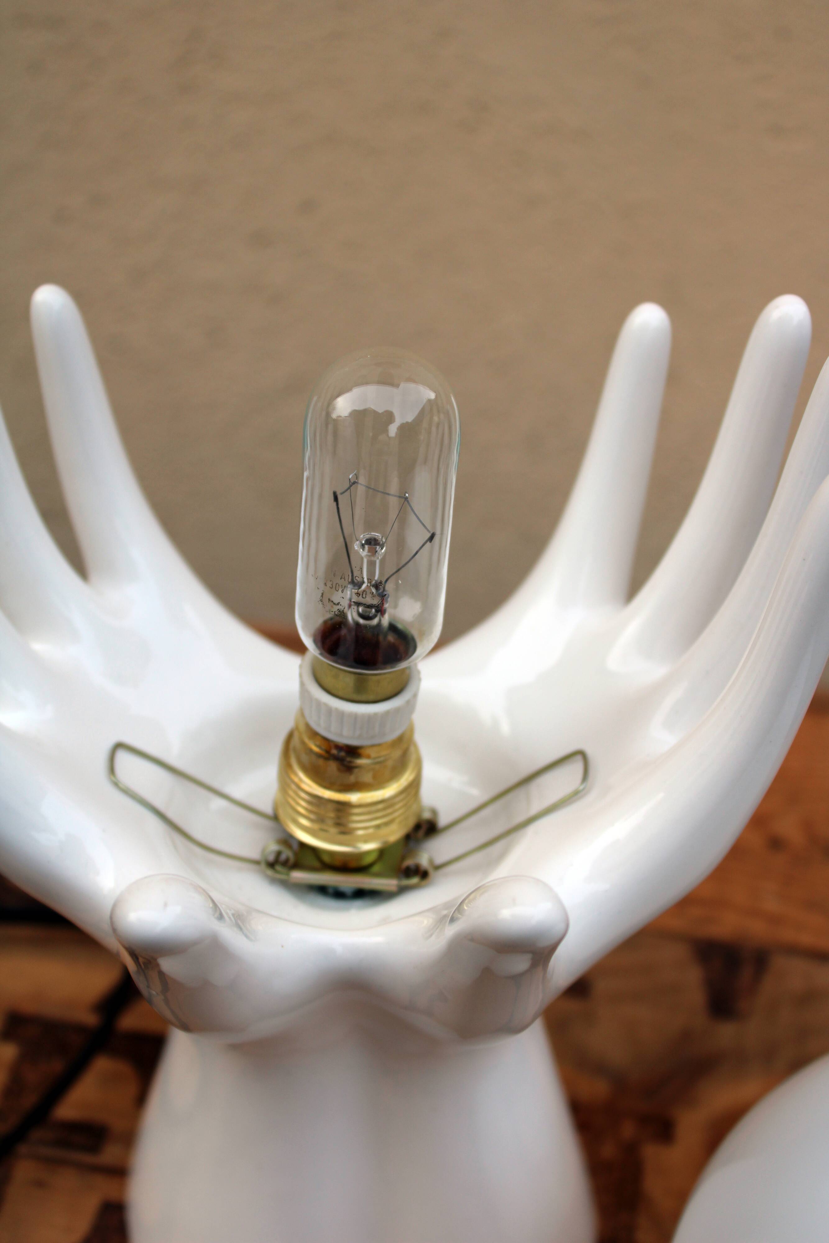 Hand-shaped lamp and opaline globe