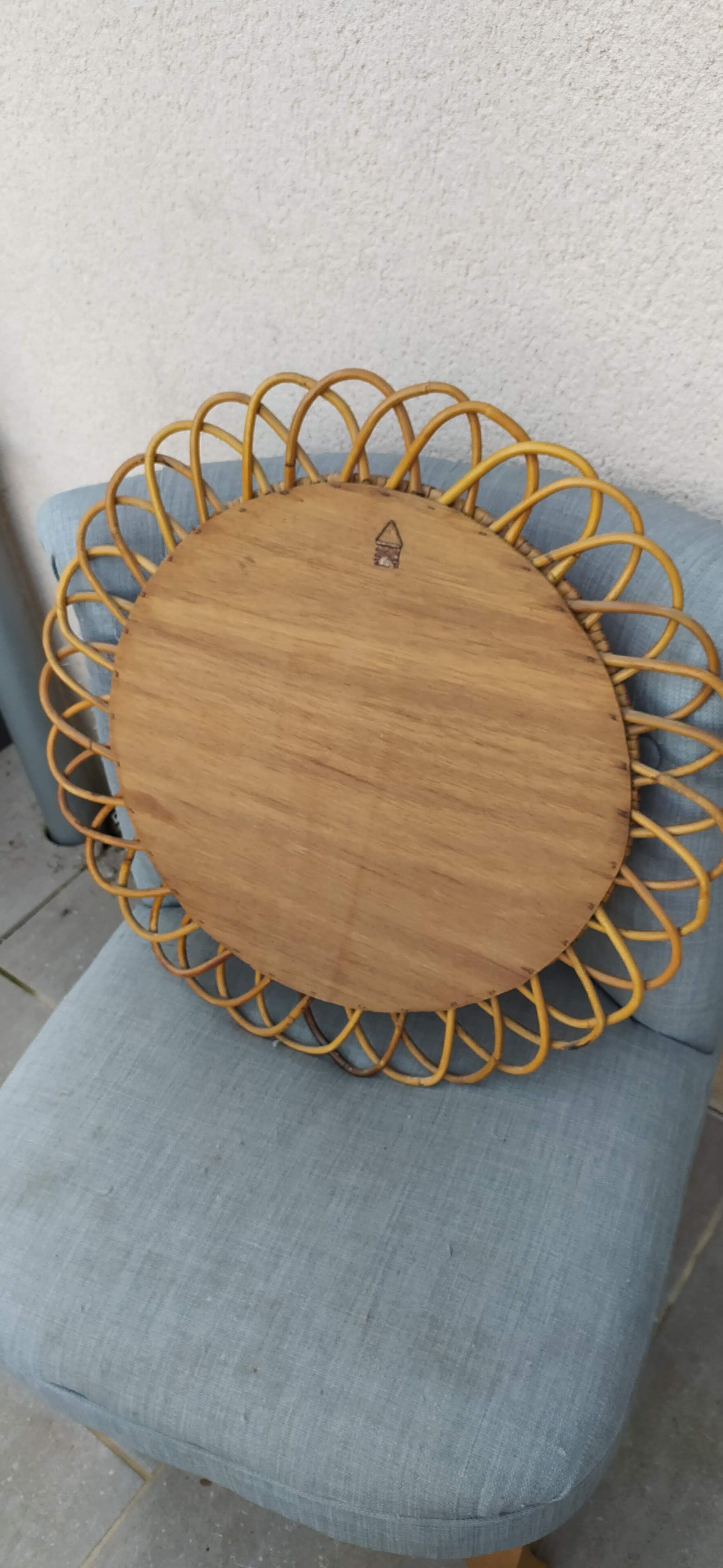 Vintage mirror in rattan flowers, sun