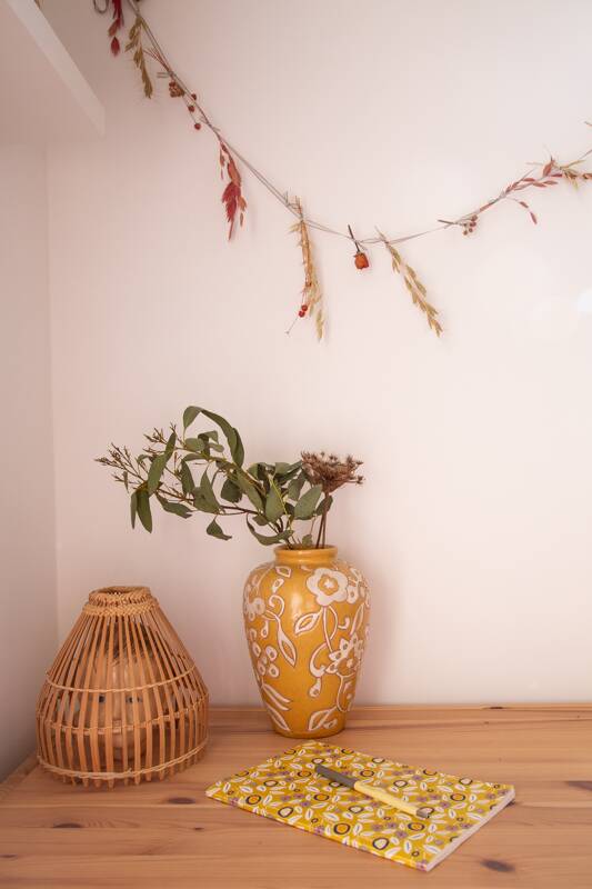 Yellow enamel vase with white flower decoration